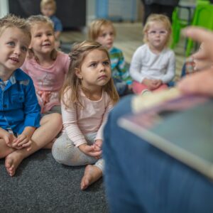 Children attentively listening to a story