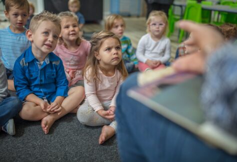 Children attentively listening to a story