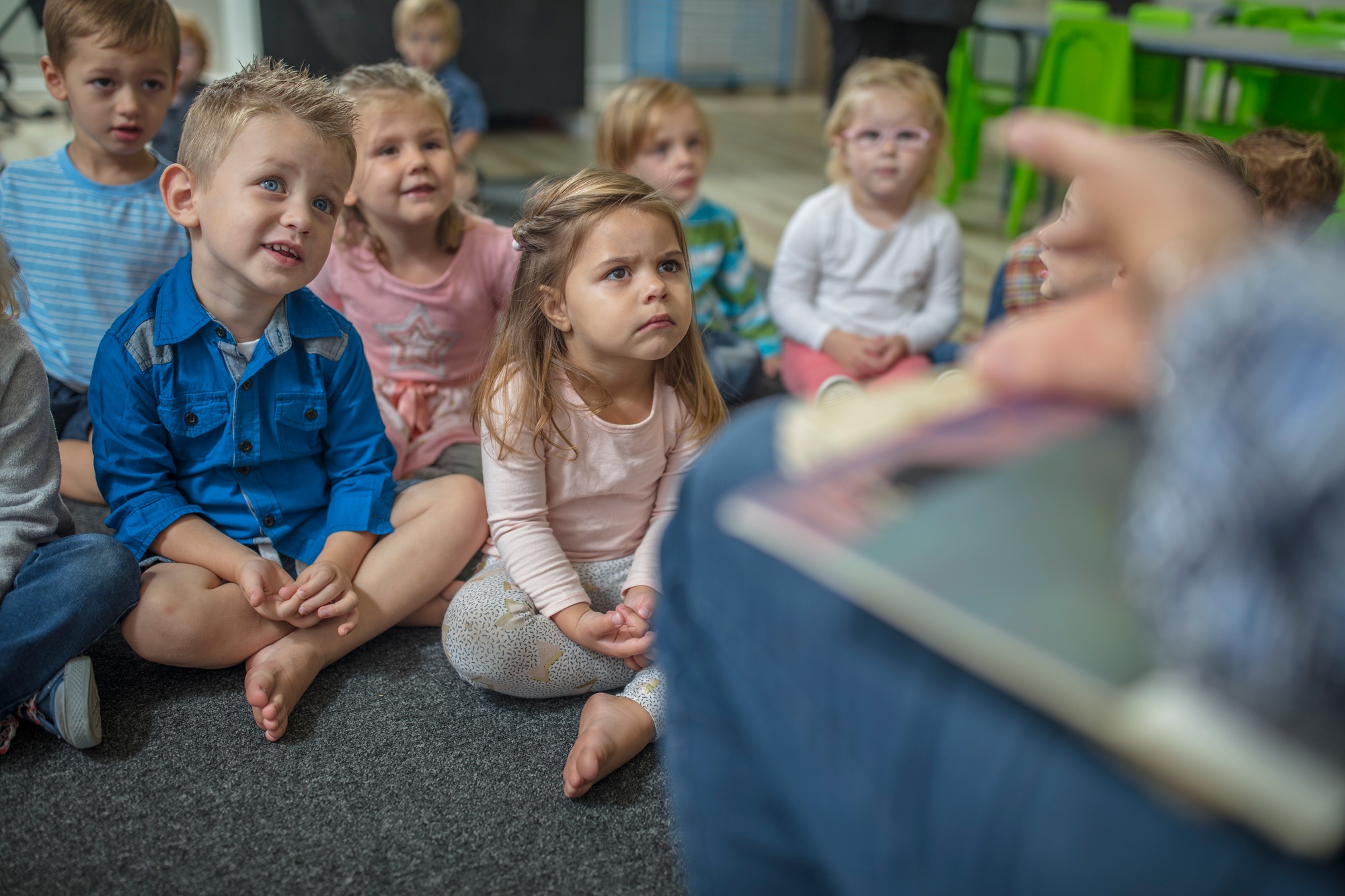 Children attentively listening to a story